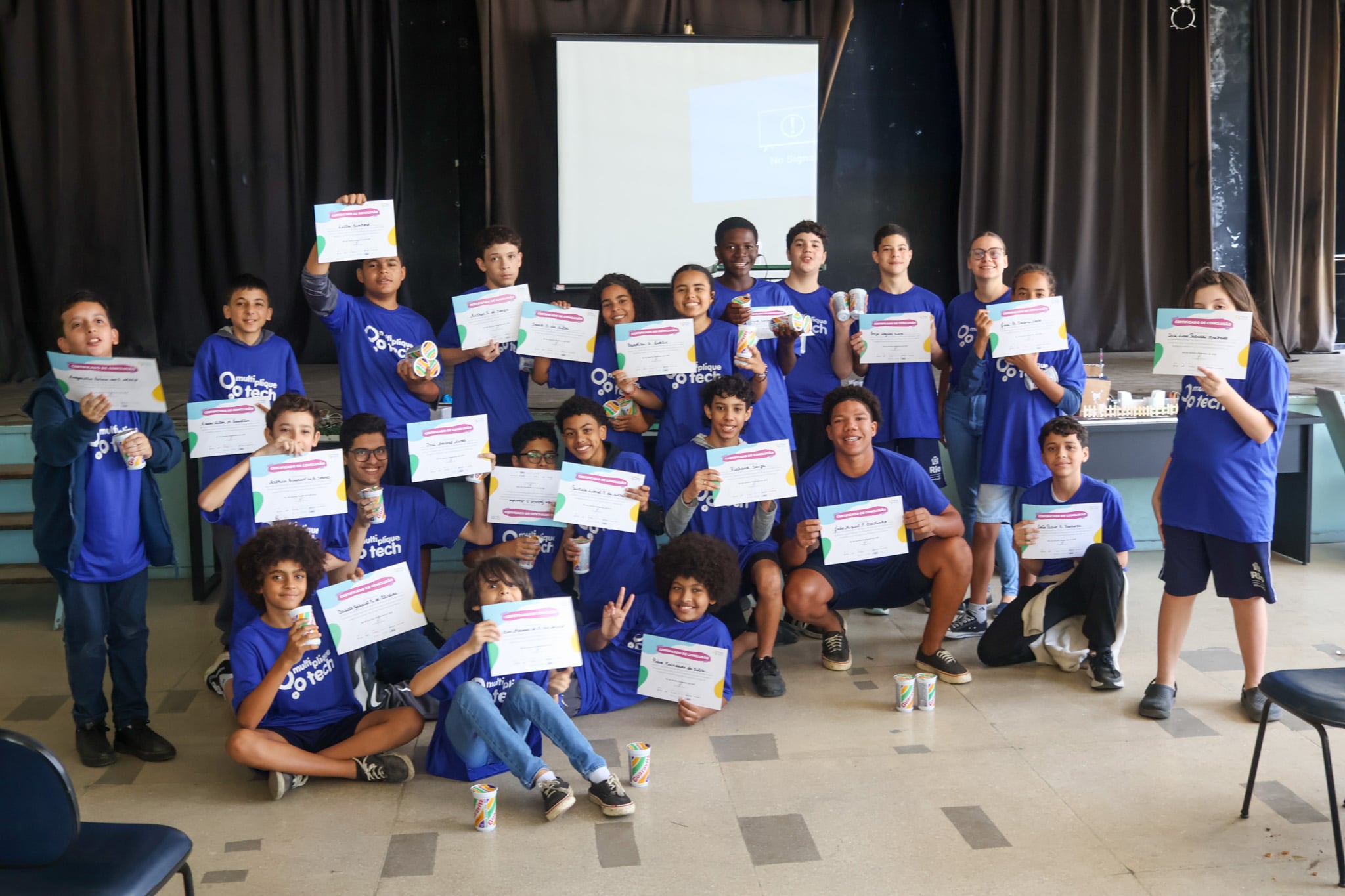 Students holding certificates awarded through a technology and digital learning programme at GET Ridalvia Corr&ecirc;a Public School