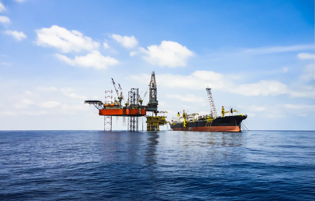 Offshore oil and gas industry facility with drilling rig, oil platform and FPSO shutterstock_1028964364