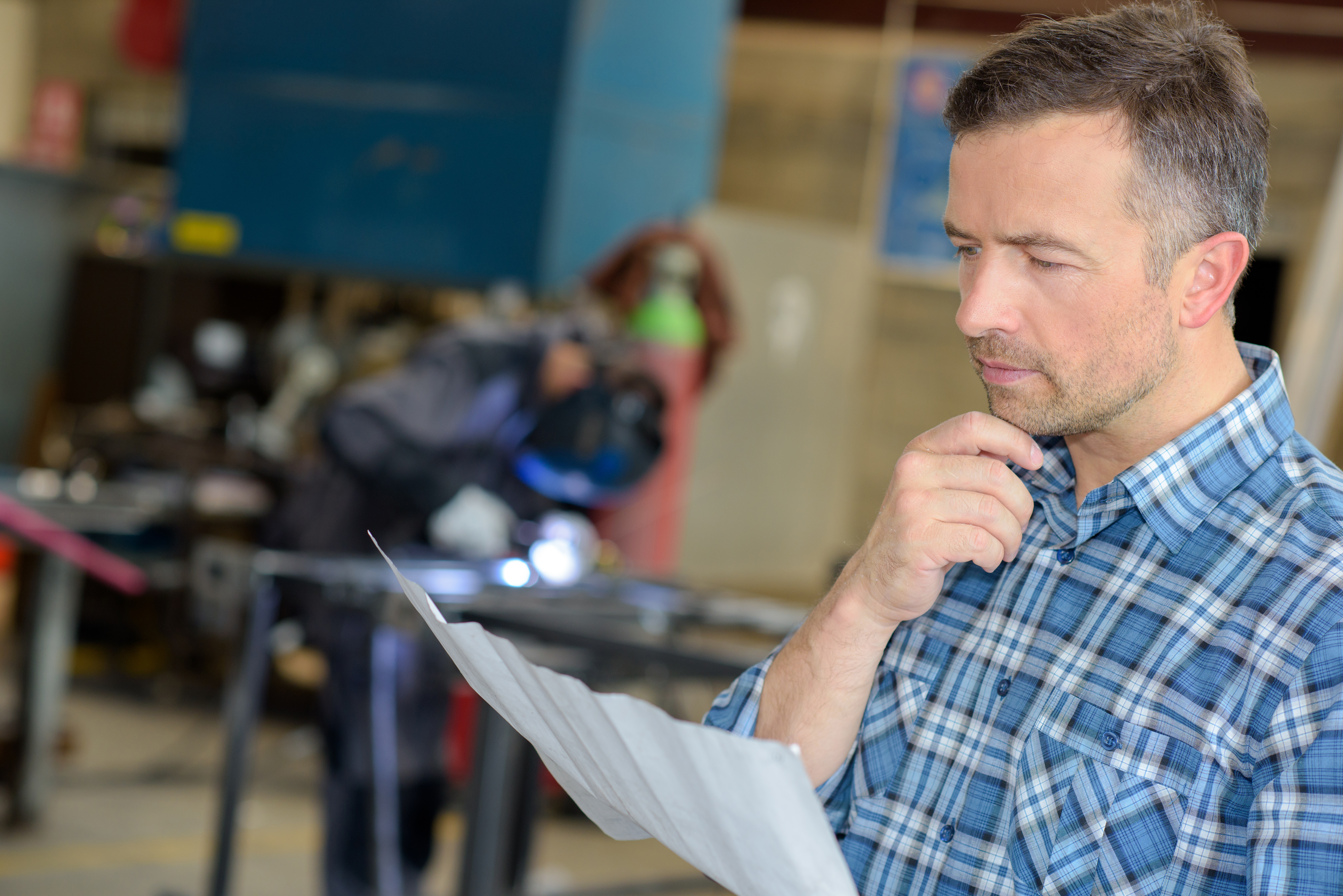 Man Reading Welding Report